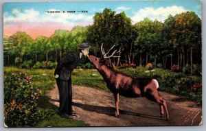 Postcard Grayling MI c1940s Greetings from Grayling Michigan Man Kissing a Deer