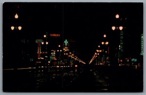 Postcard New Orleans LA c1960s Canal Street At Night Neon Signs Shops R. J. Ord 