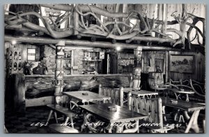 Postcard RPPC c1950s Cross Village MI Legs Inn Interior View Dining Room & Bar