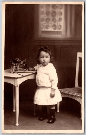 Postcard RPPC 1910s Studio Photo of Young Girl named Jacky Toy Horse Cart Figure
