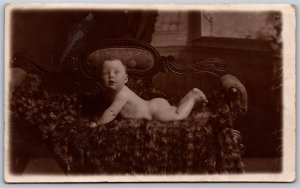 Postcard RPPC c1910s Studio Photo of Baby on Seti by Cooper Bros of Blackpool