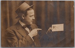 RPPC c1910s Man in Hat and Suit Holding a Postcard Real Photo