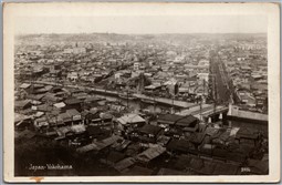Postcard RPPC c1920s Yokohama Japan Birds Eye View Shops Signs River Boats
