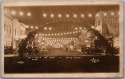 RPPC 1910s International Falls MN Night View Main Street Golden Grain Belt Beers