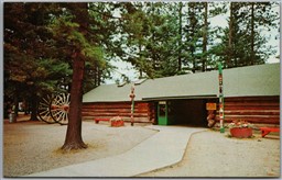 Postcard Rhinelander Wisconsin c1960s Logging Museum Entrance Big Wheels