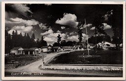Postcard RPPC 1940s Coeur D'Alene Idaho Pines Motel American Flag by Bob's Photo