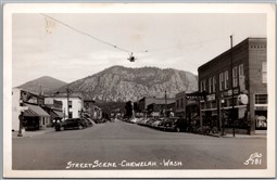 Postcard RPPC Chewelah Washington 1951 Streen Scene Old Cars Shop Stevens County