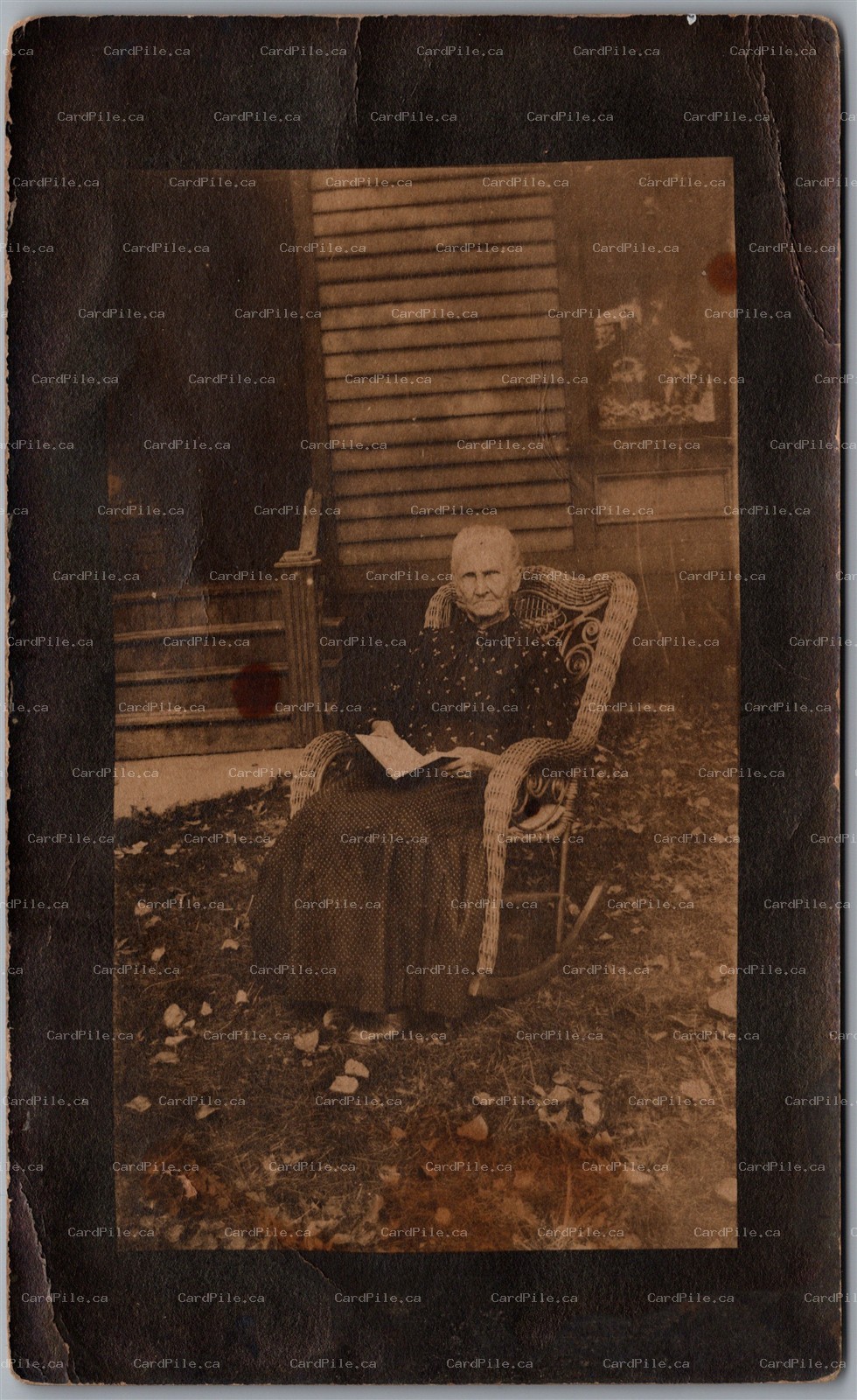 Postcard RPPC c1910s Elderly Woman in Wicker Rocking Chair Reading Outdoor Scene