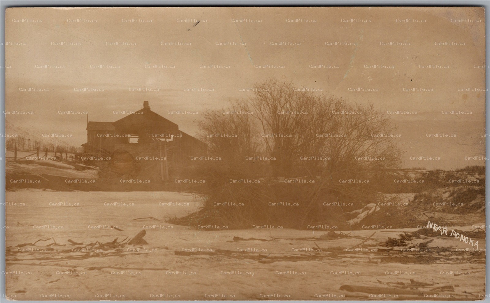 RPPC 1910 Ponoka Alberta Winter Scene Farm Building Split Ring Cancel Bismark AB