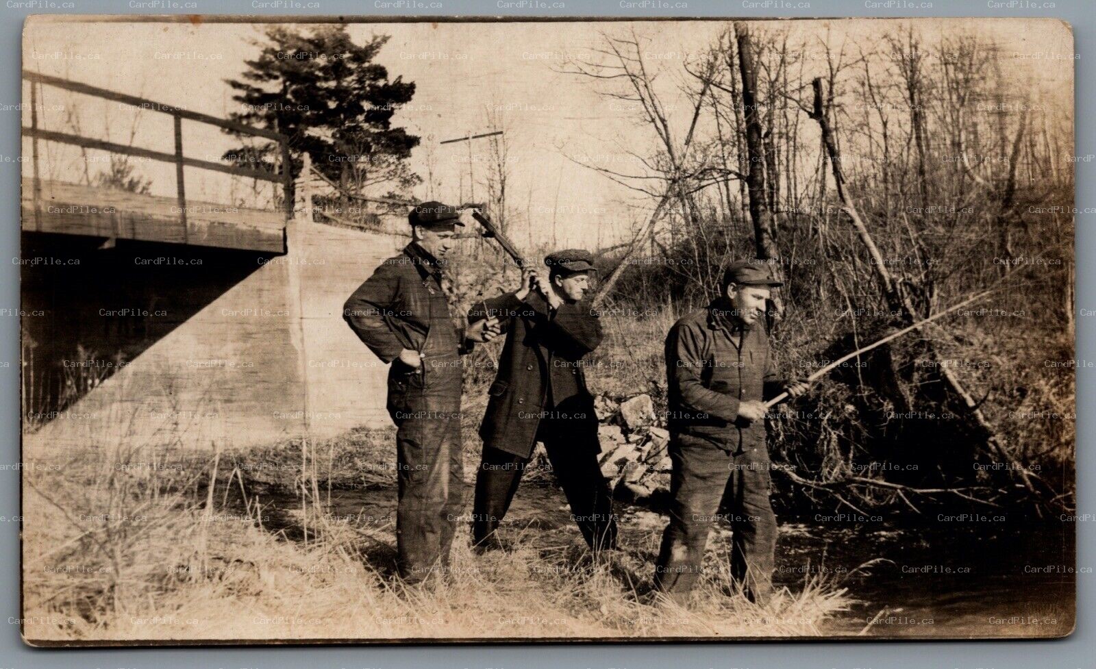 Postcard RPPC United States c1907-1920 3 Men Fishing in Creek Near Bridge