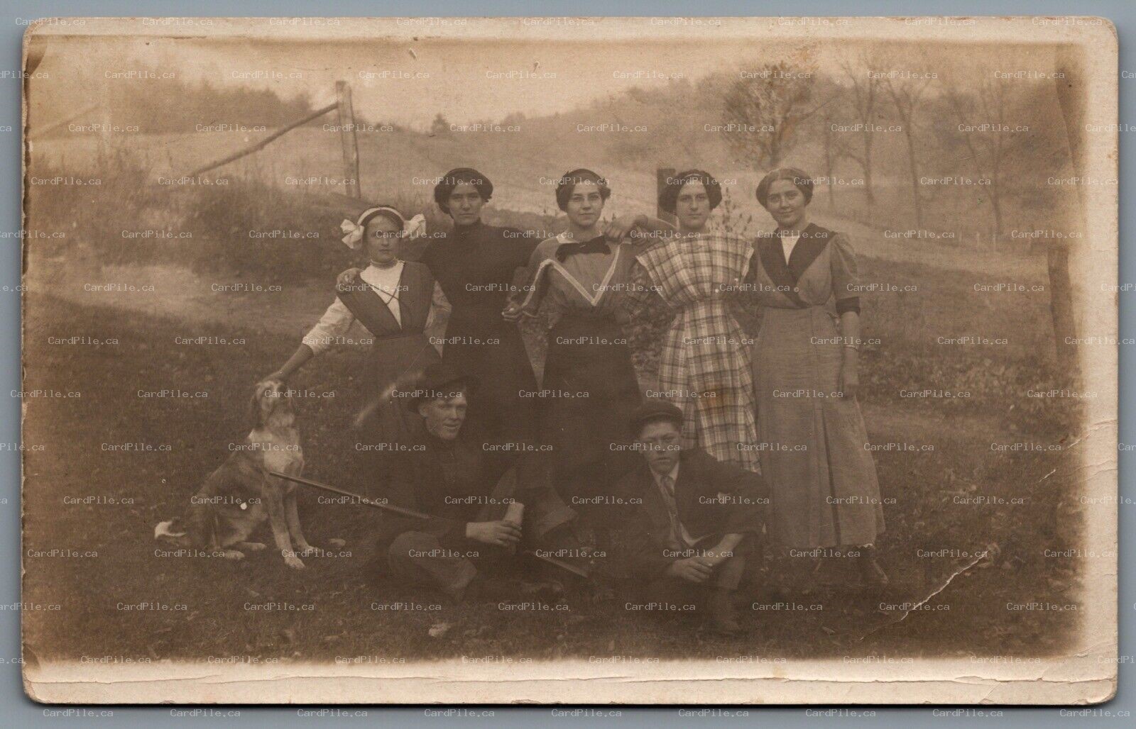 Postcard RPPC United States c1912 Group Photo with Dog Man with Long Gun Musket?