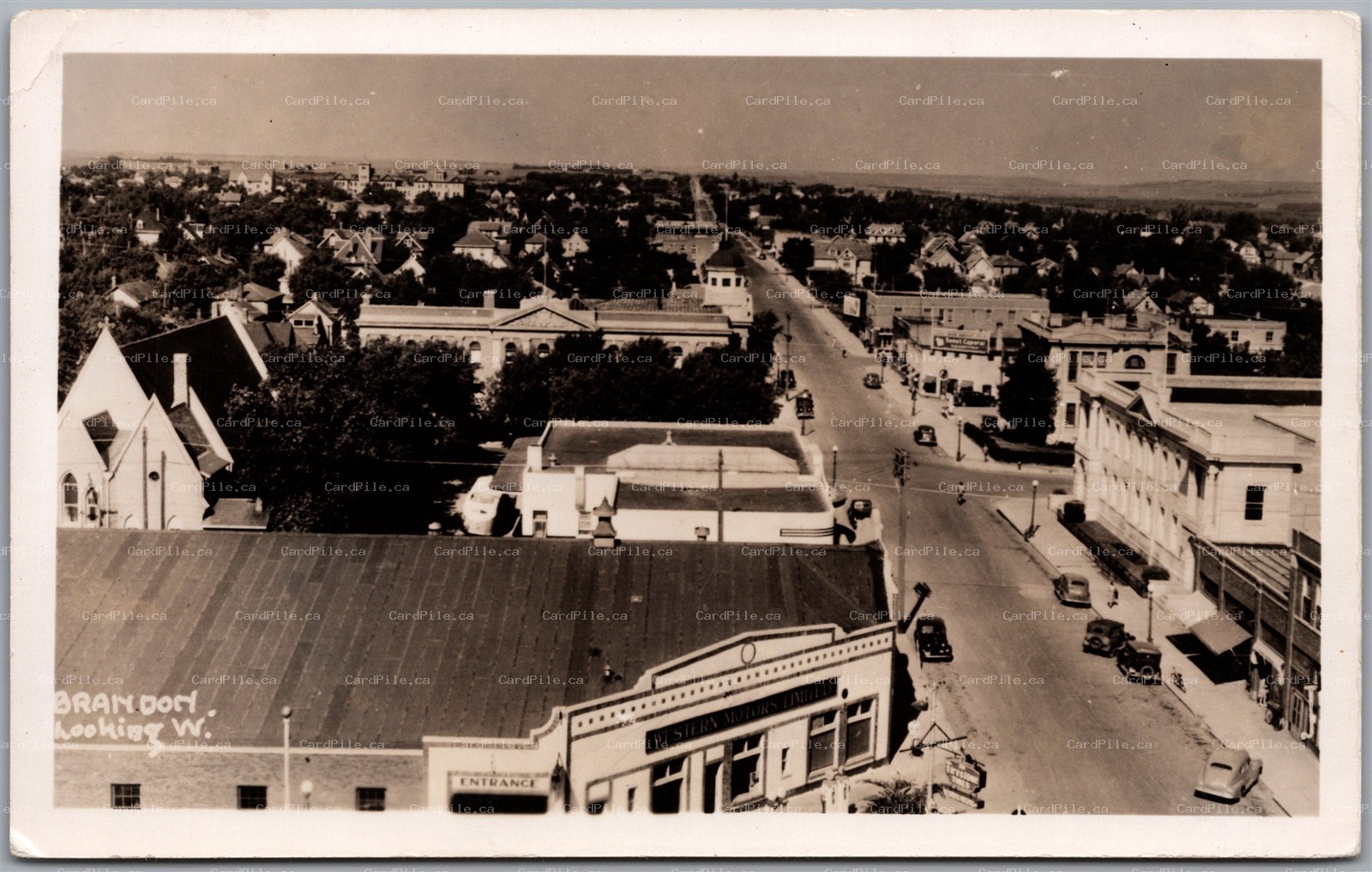 Postcard RPPC Brandon Manitoba Looking West Western Motors Gas Station