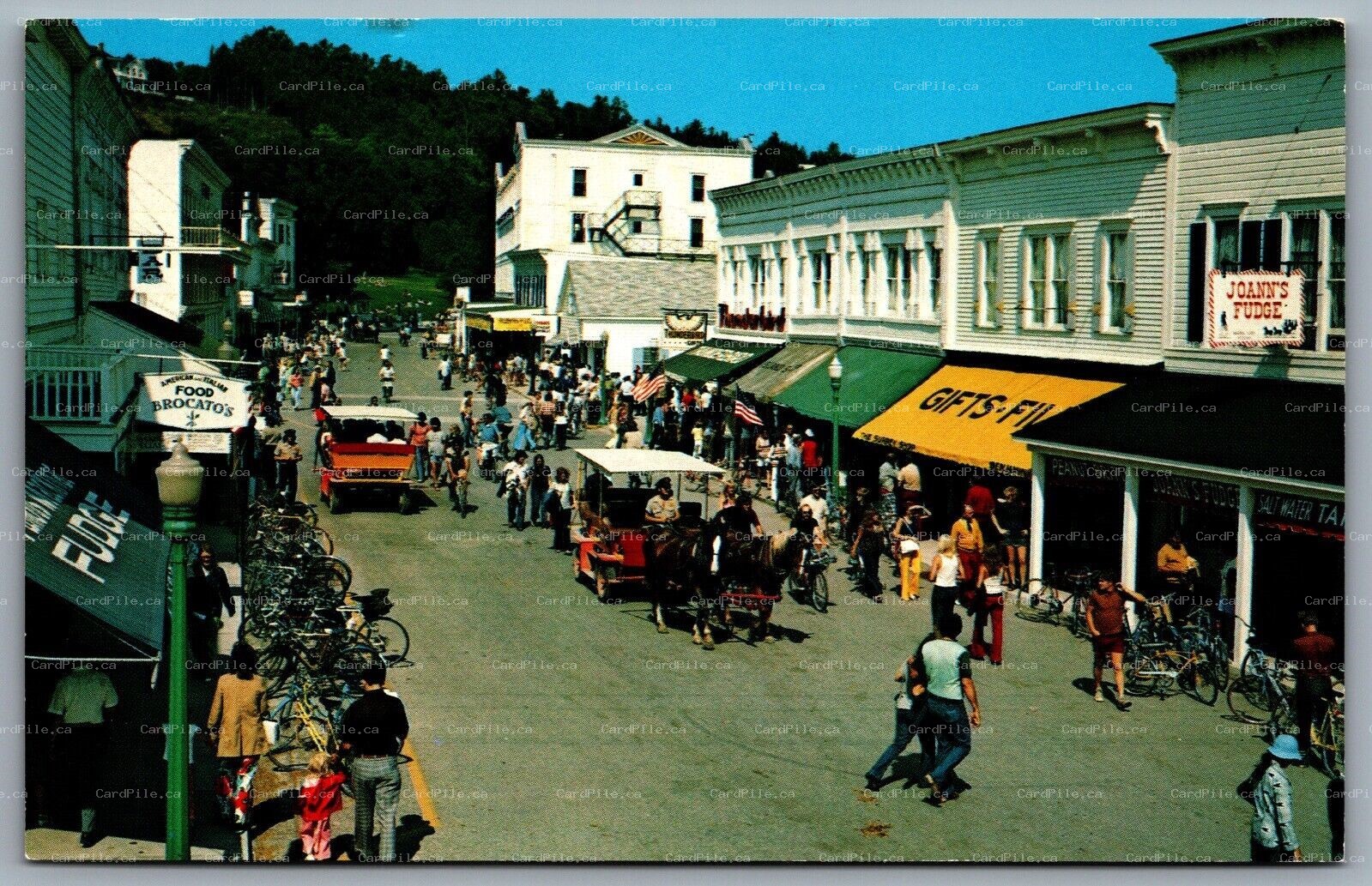 Postcard Mackinac Island MI Main Street View Horse Drawn Carriages Fudge