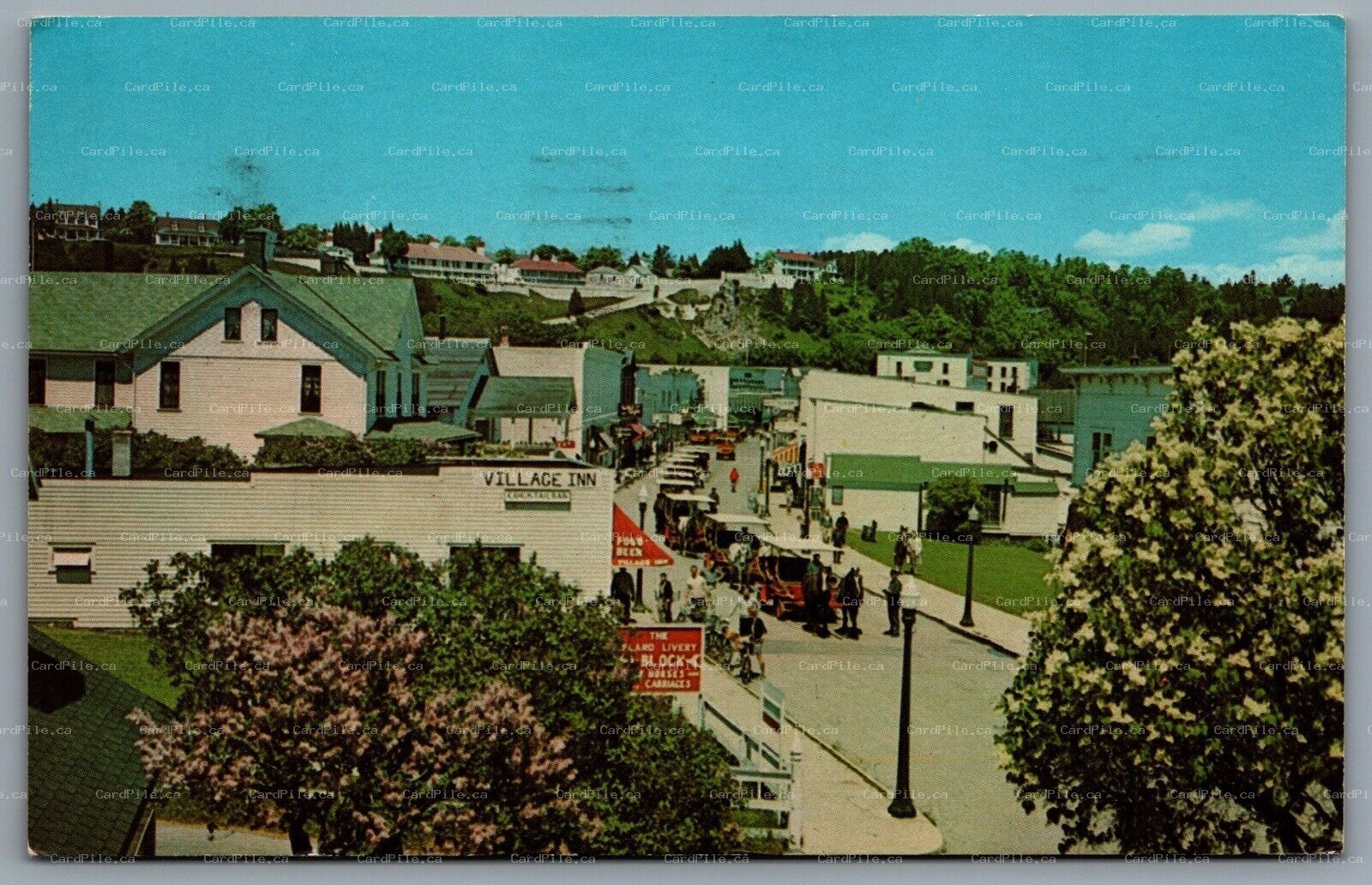 Postcard Mackinac Island MI c1967 Main Street View Shops Horse Carriages Lilacs