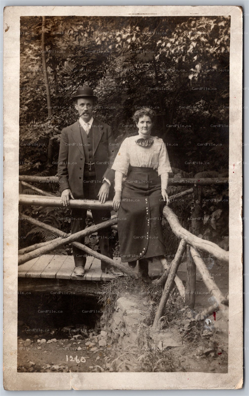 Postcard RPPC c1910s Photo of Couple Outside Man Smoking Pipe by Walton I.O.M.