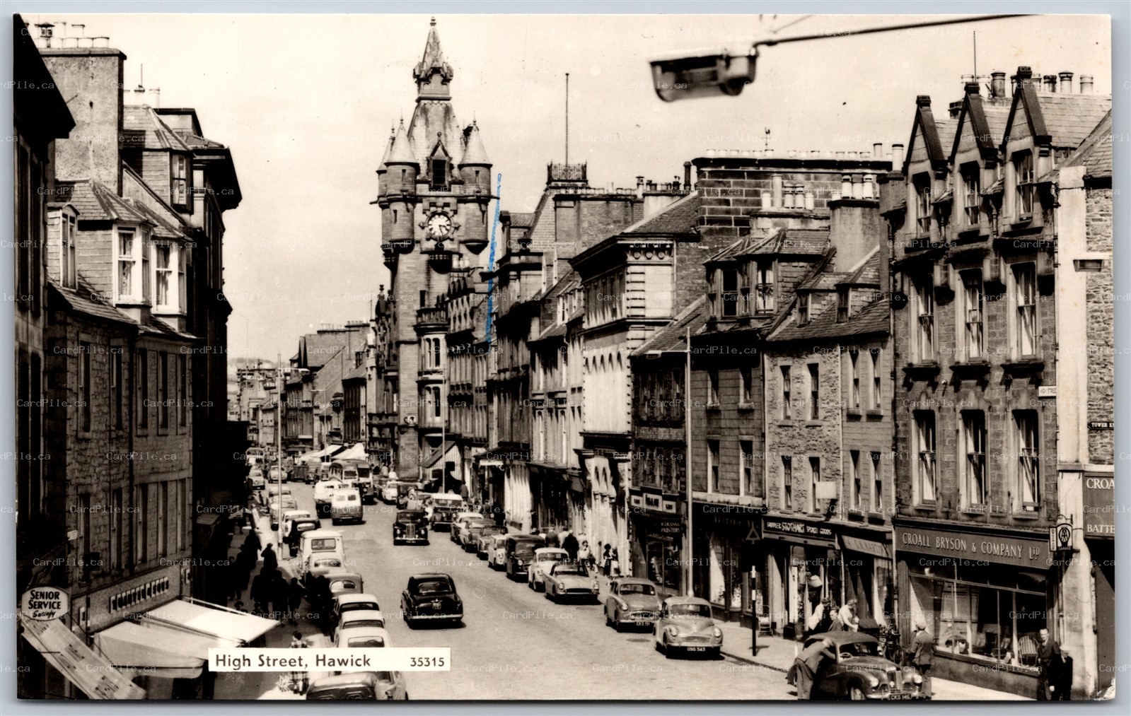 Postcard RPPC Hawick England High Street Roxburghshire Old Cars Shops Signs