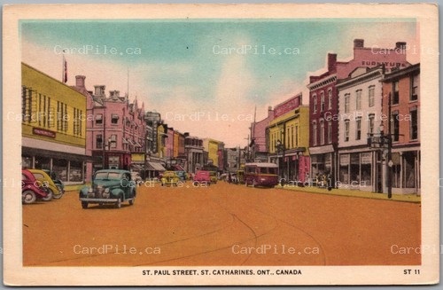Postcard St. Catharines Ontario c1940s St. Paul Street Old Cars Bus Store Fronts