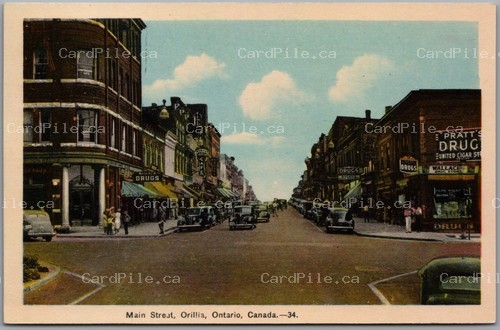 Postcard Orillia Ontario c1940s Main Street Drug Stores Cafe Old Cars