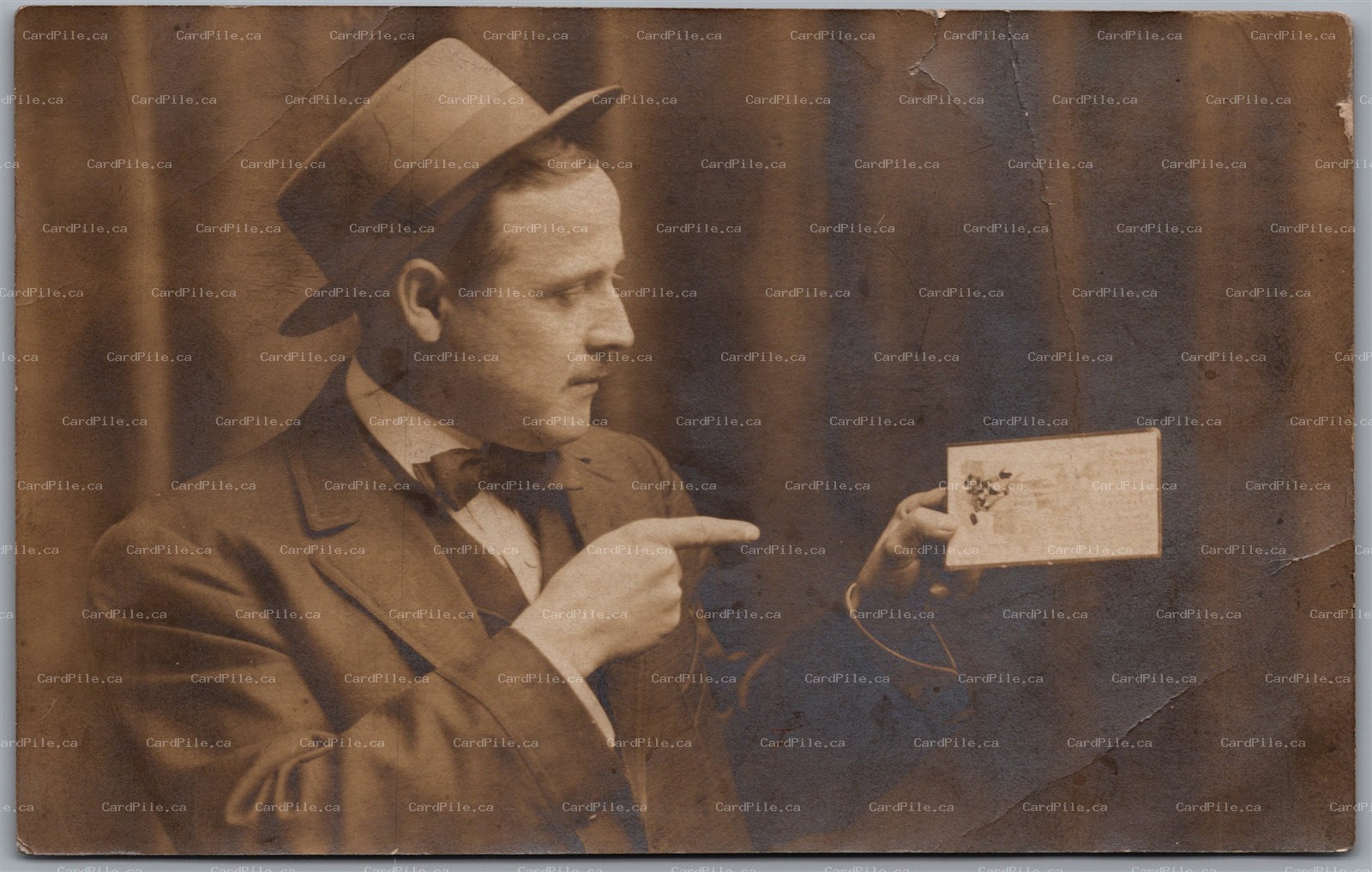 RPPC c1910s Man in Hat and Suit Holding a Postcard Real Photo