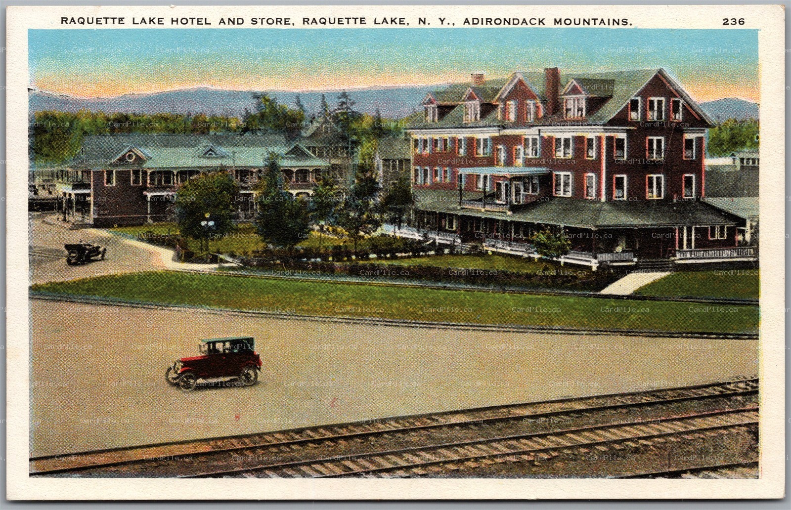 Postcard Raquette Lake New York Hotel and Store Adirondack Mountains RR Tracks